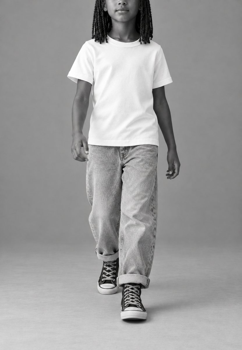 Child wearing a plain white kids t-shirt, ready to be printed with your own creation